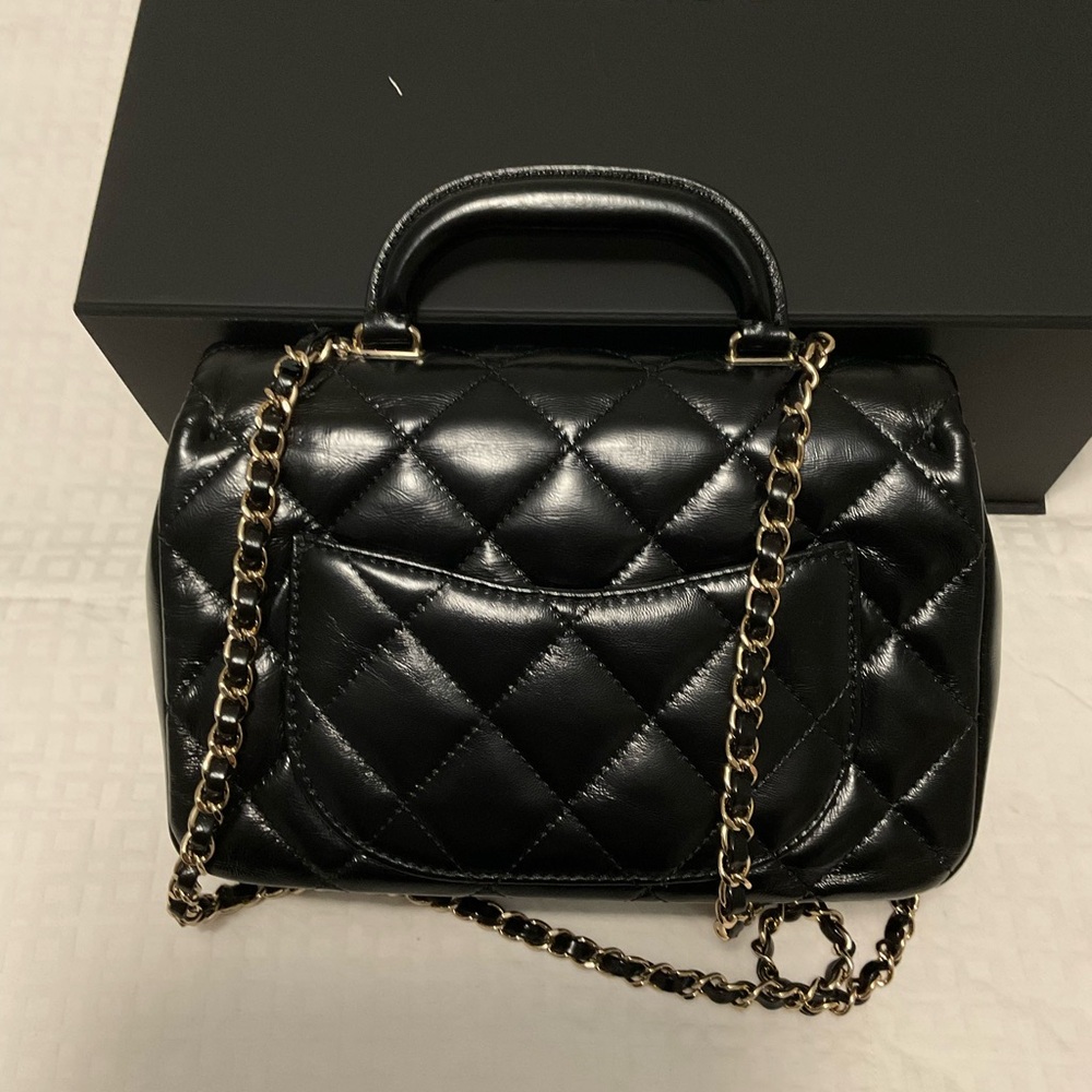 CHANEL Shiny Lambskin Quilted Coco
Trip Flap Bag Black Item #: 1807911 - Picture 12 of 13